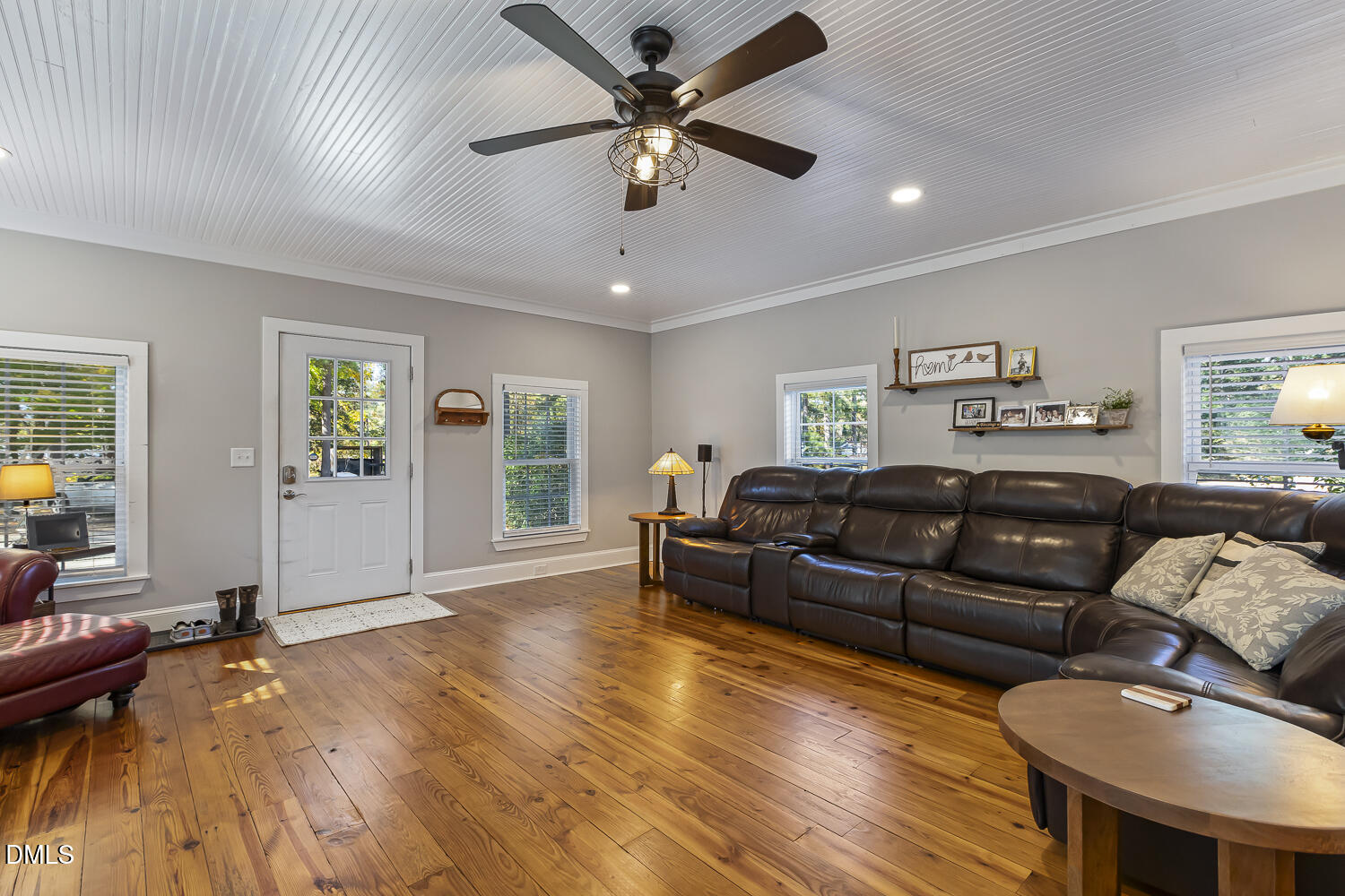 129 Kipling Road Fuquay-Varina, NC 27526 - Photo 33 of 58 a living room with furniture and a wooden floor