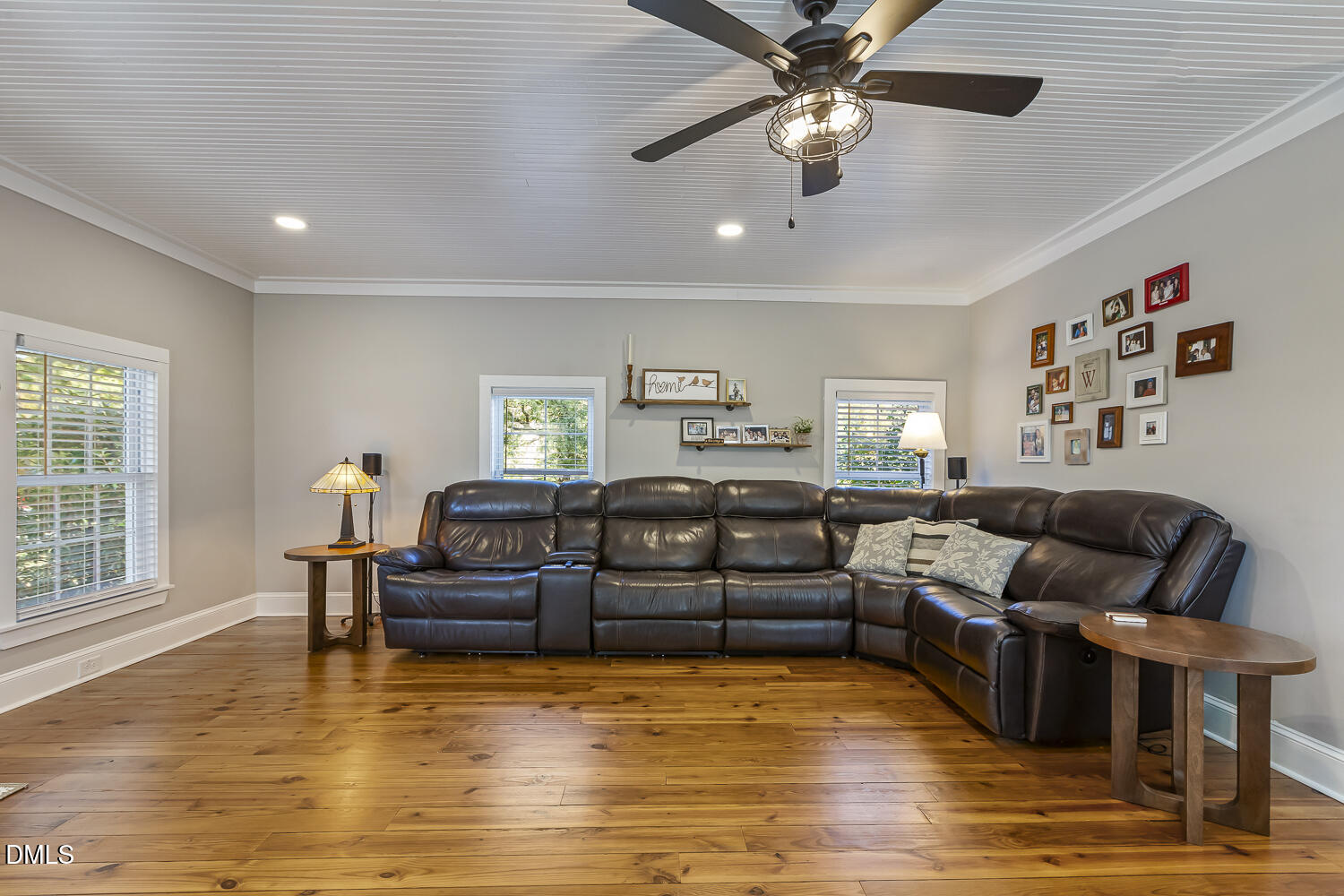 129 Kipling Road Fuquay-Varina, NC 27526 - Photo 34 of 58 a living room with furniture and a wooden floor