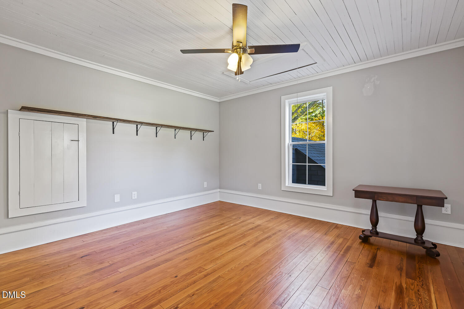 129 Kipling Road Fuquay-Varina, NC 27526 - Photo 37 of 58 a view of an empty room with window and wooden floor