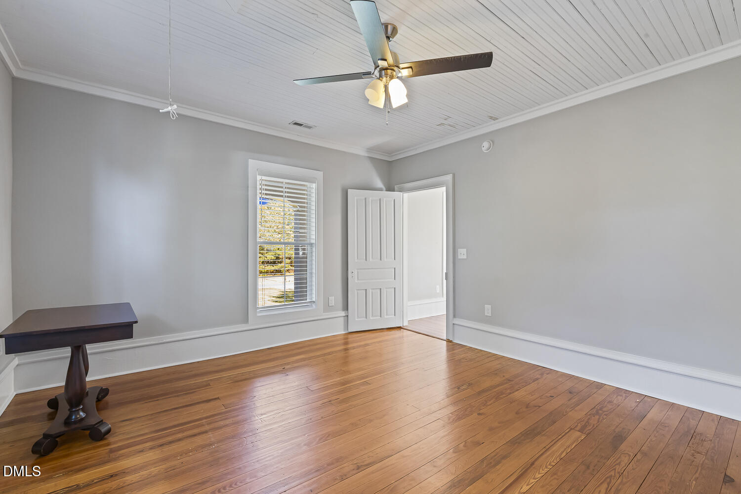 129 Kipling Road Fuquay-Varina, NC 27526 - Photo 39 of 58 a view of an empty room with window and wooden floor