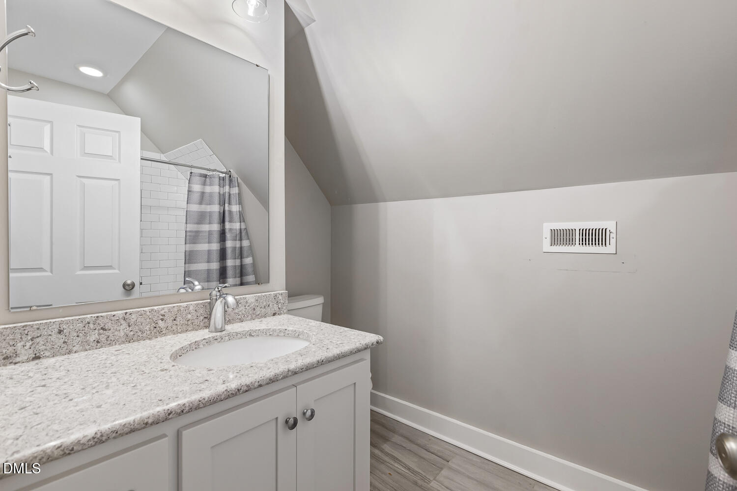 129 Kipling Road Fuquay-Varina, NC 27526 - Photo 44 of 58 a bathroom with a granite countertop sink and a mirror