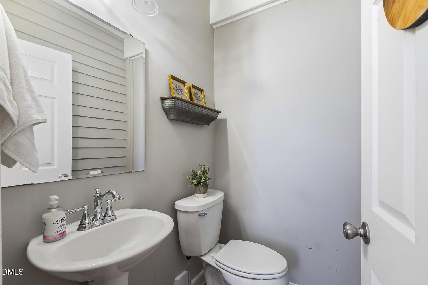 129 Kipling Road Fuquay-Varina, NC 27526 - Photo 46 of 58 a bathroom with a sink a toilet and mirror