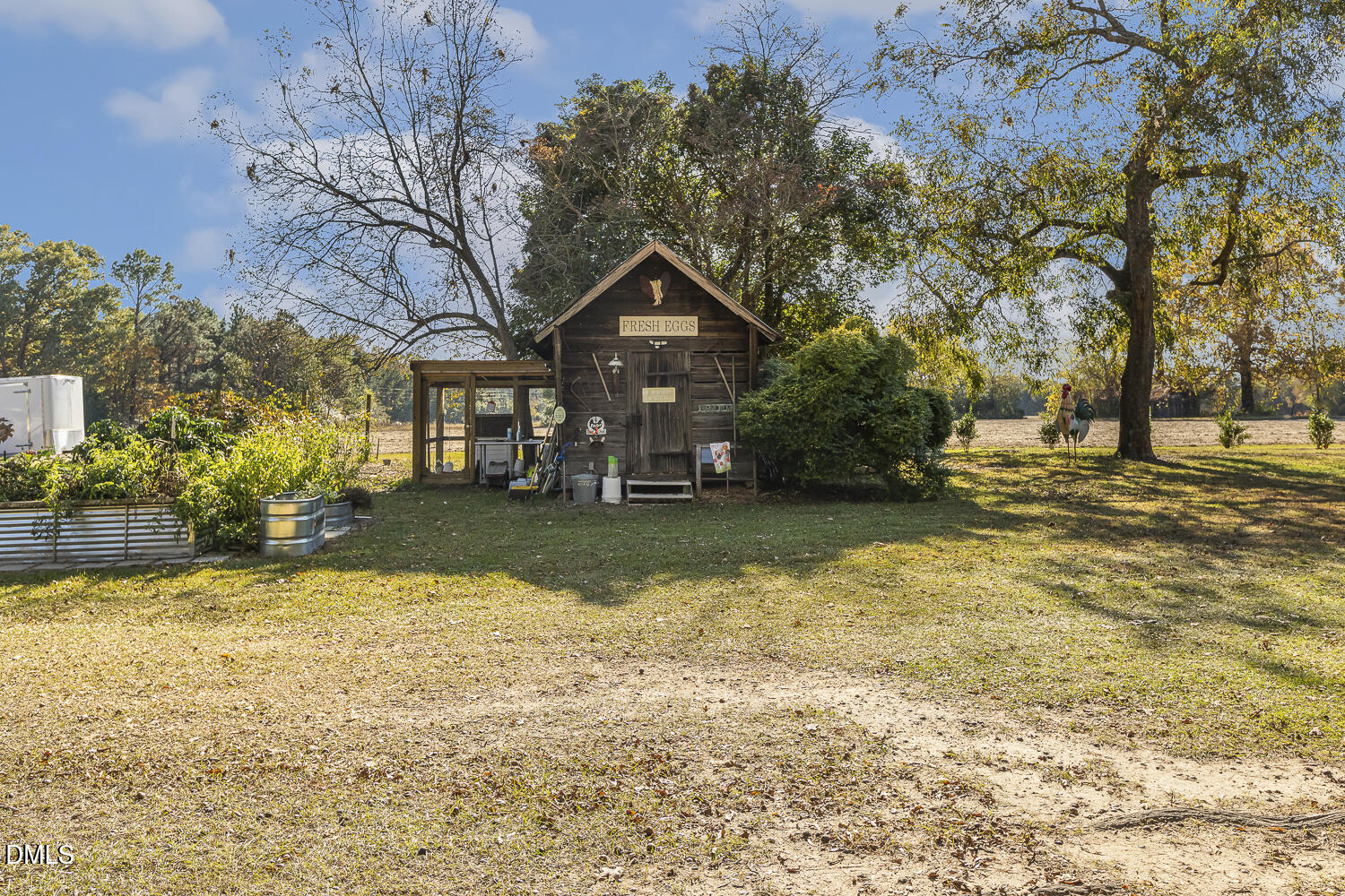 129 Kipling Road Fuquay-Varina, NC 27526 - Photo 55 of 58 a house with huge green field in front of it