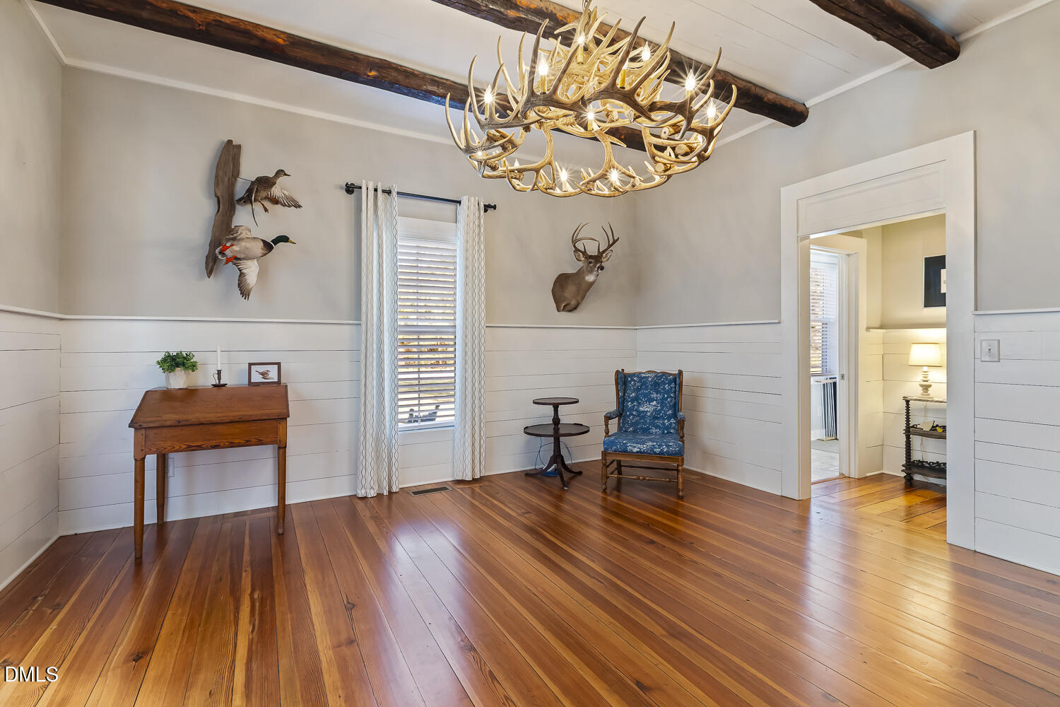 129 Kipling Road Fuquay-Varina, NC 27526 - Photo 7 of 58 a view of a livingroom with furniture wooden floor and a chandelier
