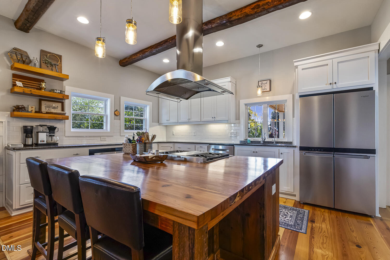 129 Kipling Road Fuquay-Varina, NC 27526 - Photo 9 of 58 a kitchen with stainless steel appliances granite countertop a table chairs refrigerator and sink