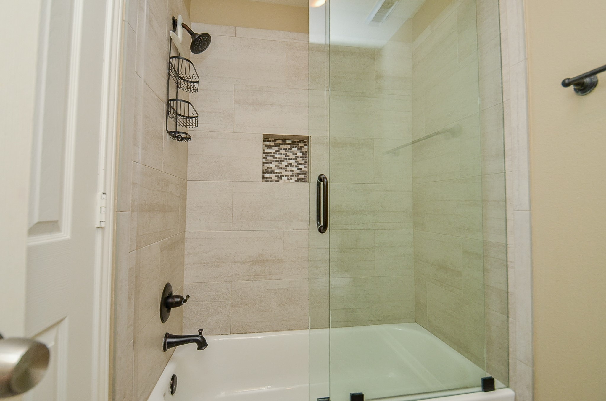 1222 Ragsdale Lane Katy, TX 77494 - Photo 26 of 31 Updated tle and glass doors were added to this tub/shower combo.