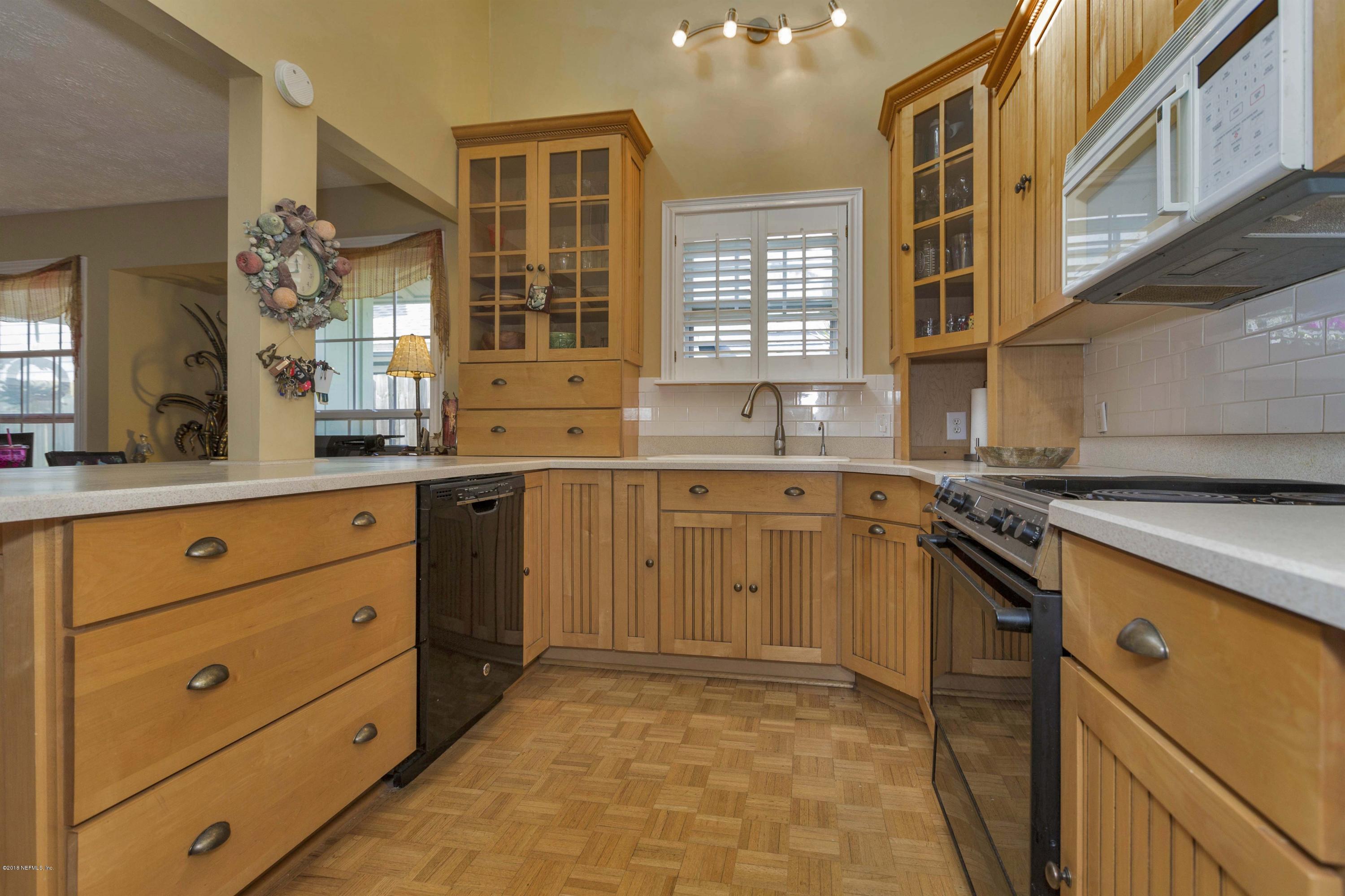 39 Solana Road Ponte Vedra Beach, FL 32082 - Photo 14 of 32 a kitchen with a stove a sink and a refrigerator