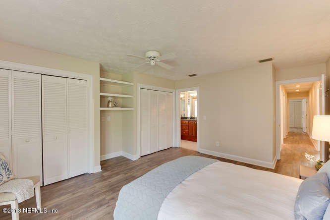 39 Solana Road Ponte Vedra Beach, FL 32082 - Photo 23 of 32 a bedroom with a bed and wooden floor