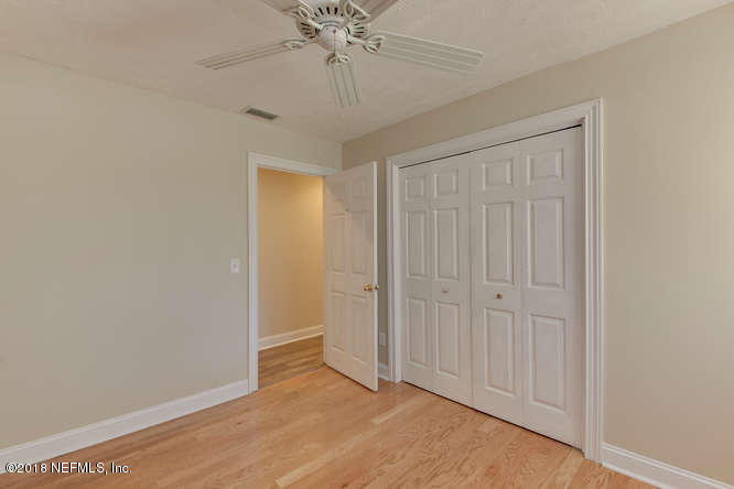 39 Solana Road Ponte Vedra Beach, FL 32082 - Photo 27 of 32 an empty room with a chandelier fan