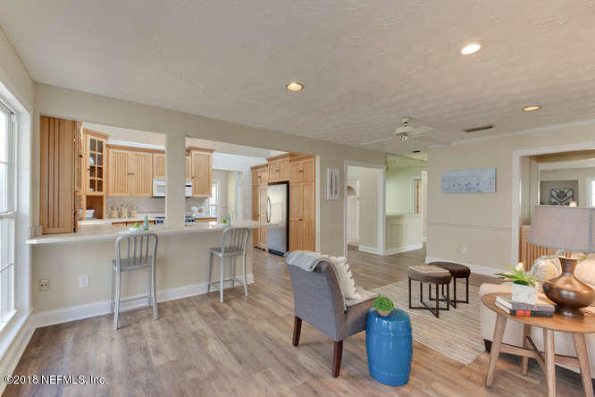 39 Solana Road Ponte Vedra Beach, FL 32082 - Photo 6 of 32 a living room with furniture a wooden floor and a large window