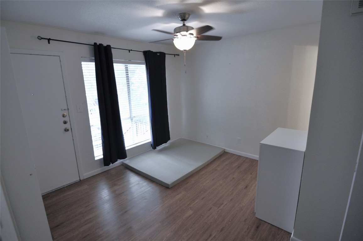 2207 Leon Street, Unit 201 Austin, TX 78705 - Photo 5 of 10 Entrance foyer featuring dark wood-type flooring and a ceiling fan