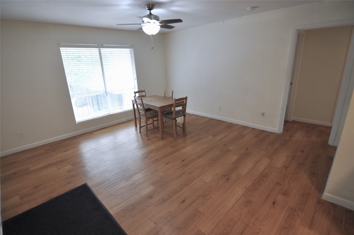 2207 Leon Street, Unit 201 Austin, TX 78705 - Photo 10 of 10 Dining room featuring wood finished floors and a ceiling fan