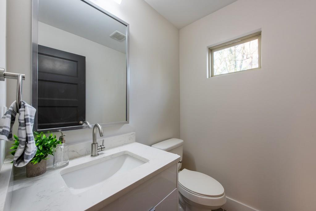 331 Eleanor Street Southeast Atlanta, GA 30317 - Photo 19 of 50 a bathroom with a sink a toilet and shower