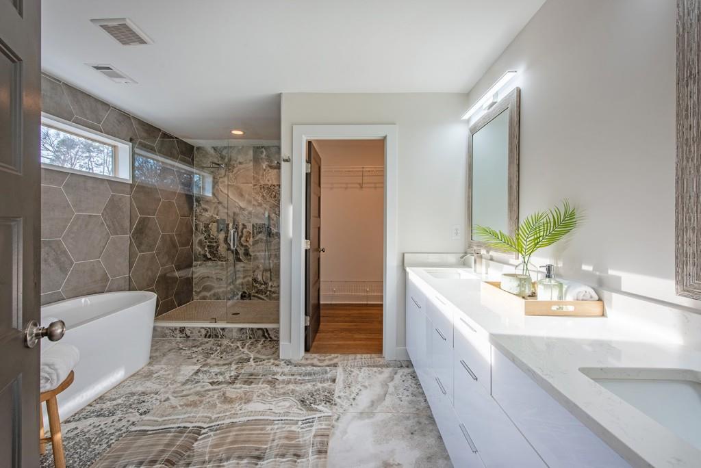 331 Eleanor Street Southeast Atlanta, GA 30317 - Photo 30 of 50 a bathroom with a double vanity sink toilet and shower