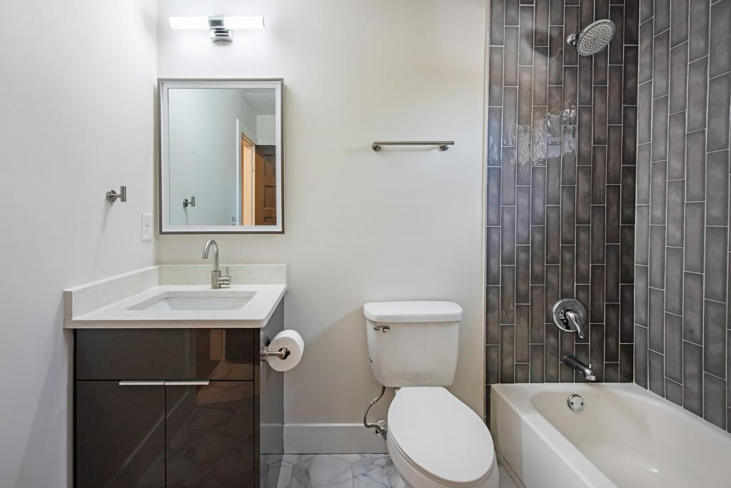 331 Eleanor Street Southeast Atlanta, GA 30317 - Photo 38 of 50 a bathroom with a sink toilet and shower