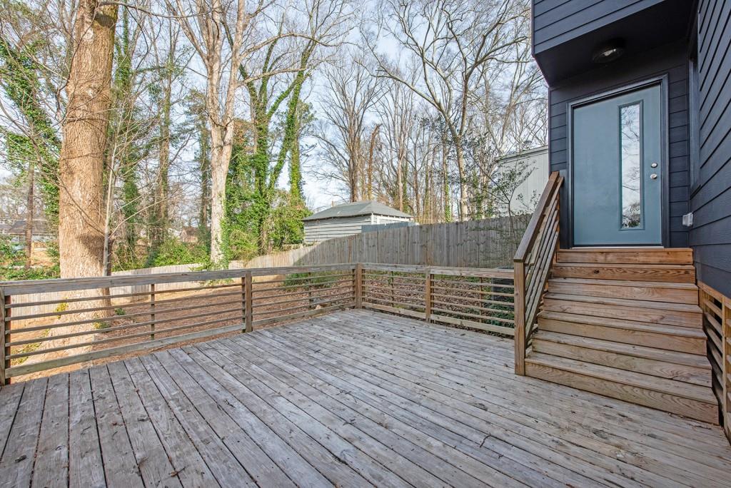 331 Eleanor Street Southeast Atlanta, GA 30317 - Photo 41 of 50 a view of backyard with deck and wooden floor