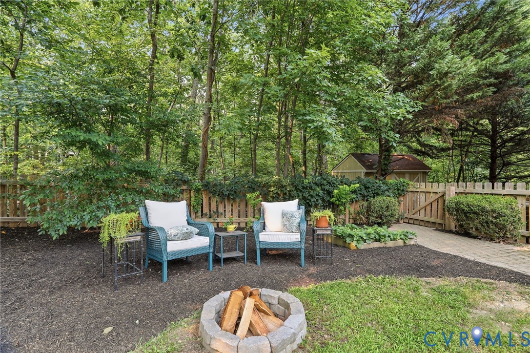 2904 Old Gun Road West Midlothian, VA 23113 - Photo 47 of 59 Backyard retreat featuring a stone fire pit, paver