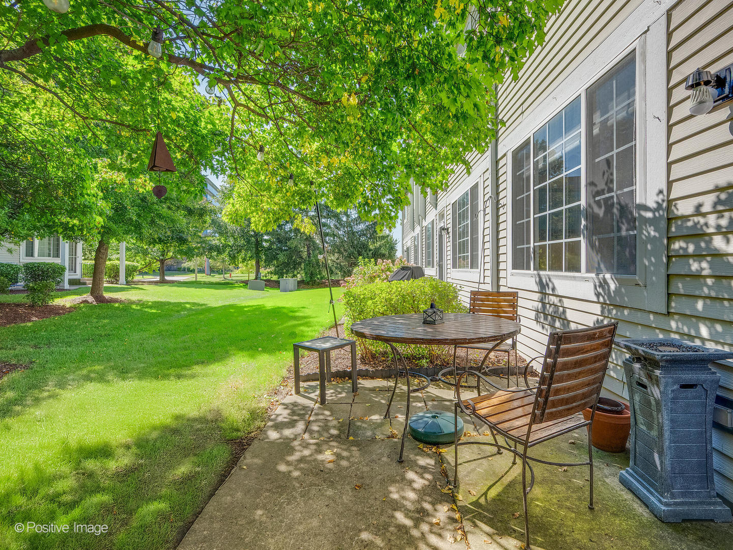 31104 Carpenter Court Warrenville, IL 60555 - Photo 29 of 32 a view of backyard with table and chairs and potted plants