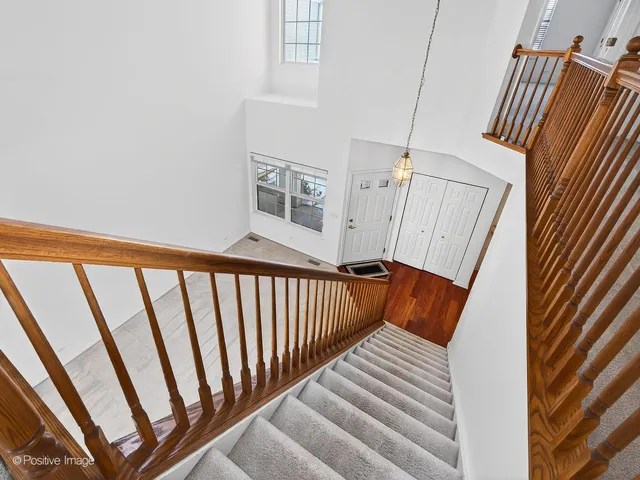 a view of stairs and with wooden floor