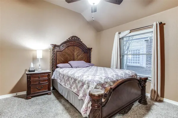 a bedroom with a bed and a cabinets