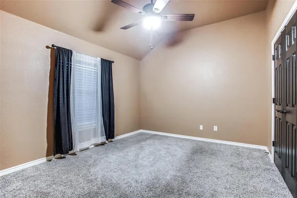 an empty room with closet area