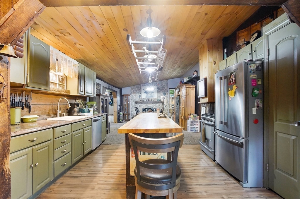 7 Davidson Road Holland, MA 01521 - Photo 15 of 32 a kitchen with a refrigerator and a sink