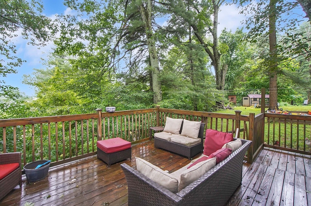 7 Davidson Road Holland, MA 01521 - Photo 24 of 32 a view of a balcony with wooden floor and outdoor seating
