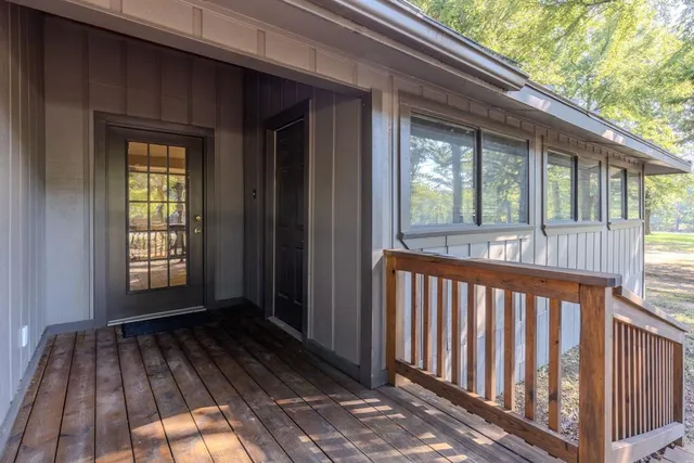 a view of a house with porch and wooden floor