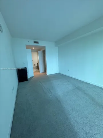 a bathroom with a sink a toilet and a shower