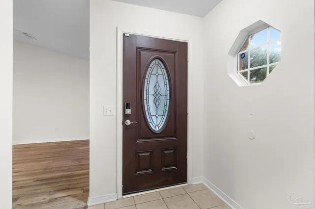 a front view of a house with entrance gate