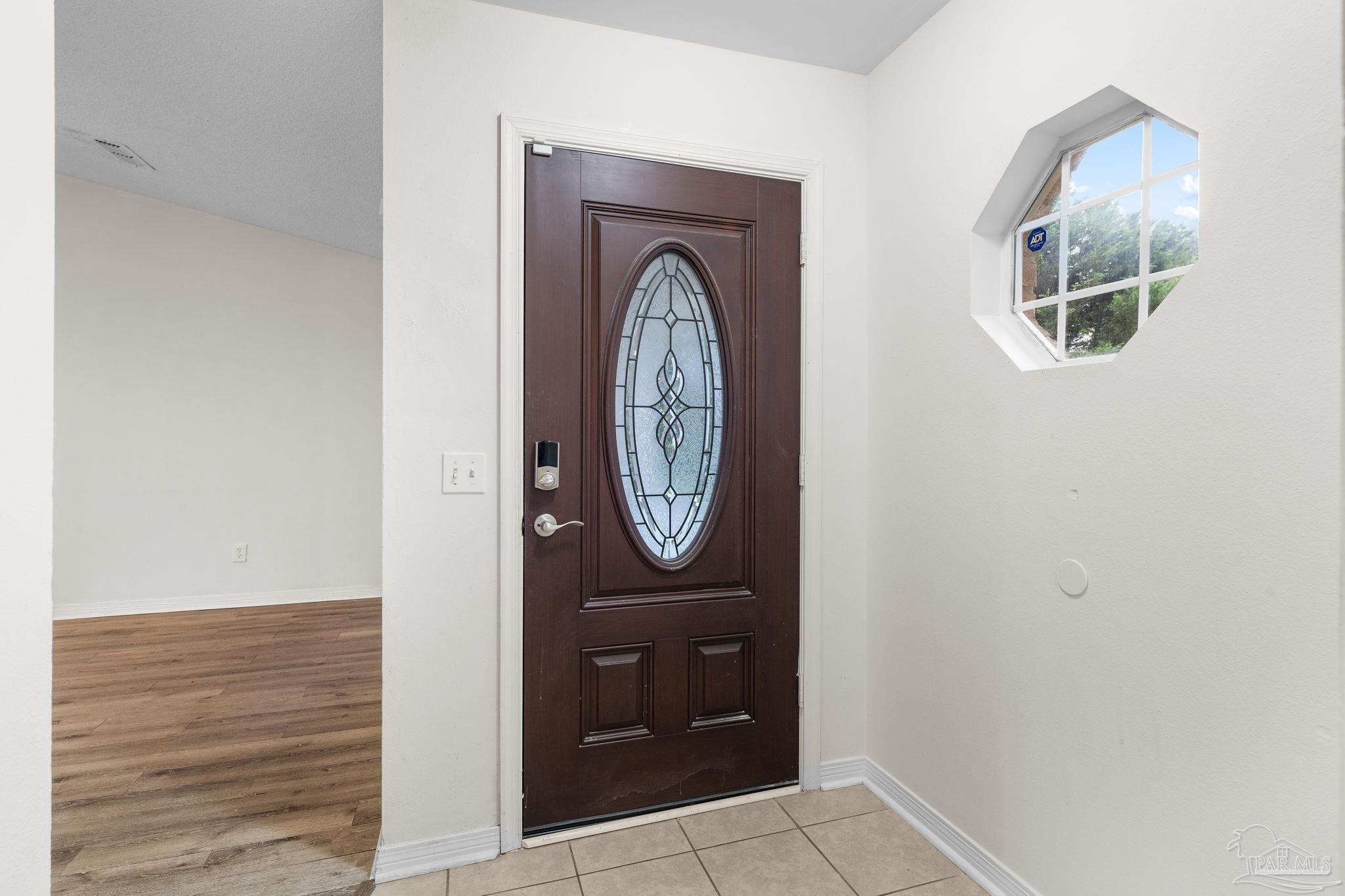 1203 Brook Bend Road Pensacola, FL 32506 - Photo 2 of 17 a front view of a house with entrance gate