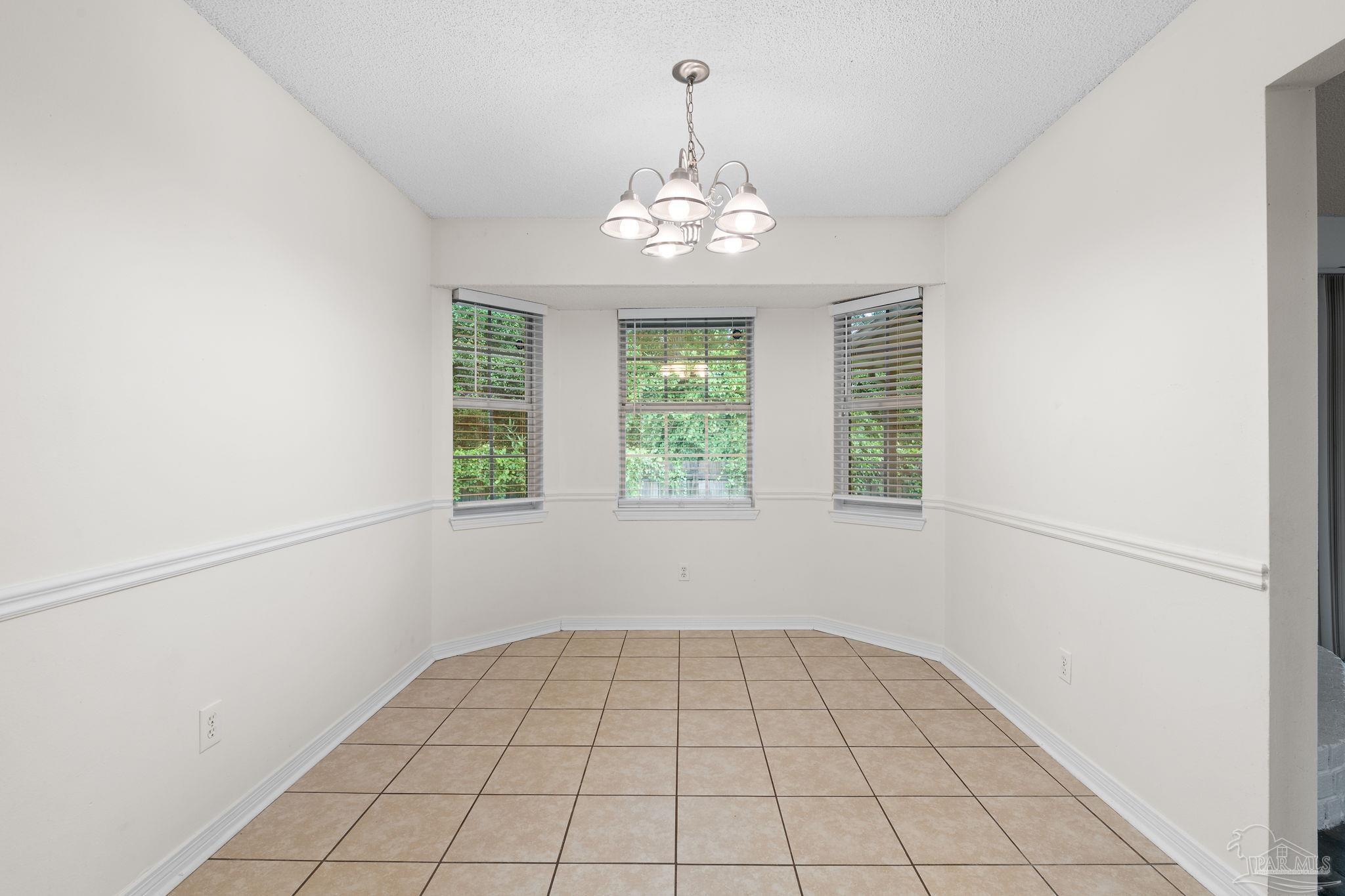 1203 Brook Bend Road Pensacola, FL 32506 - Photo 4 of 17 a view of an empty room with a window