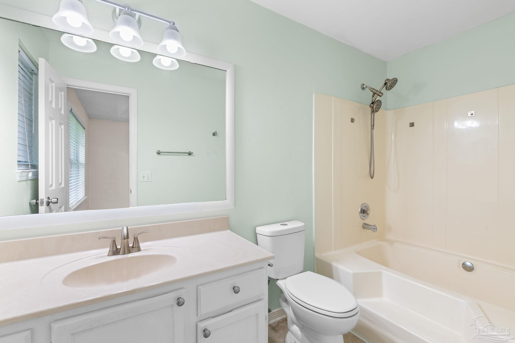 1203 Brook Bend Road Pensacola, FL 32506 - Photo 9 of 17 a bathroom with a sink a toilet and shower