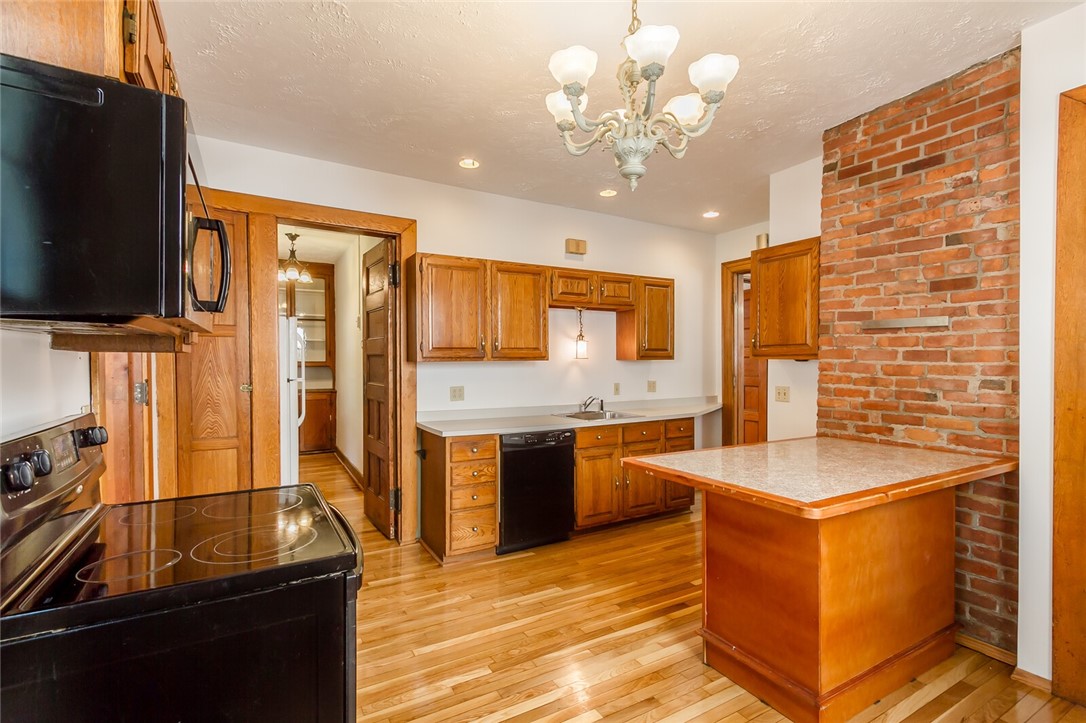 9 Menlo Place Rochester, NY 14620 - Photo 16 of 42 Eat-in kitchen with exposed brick