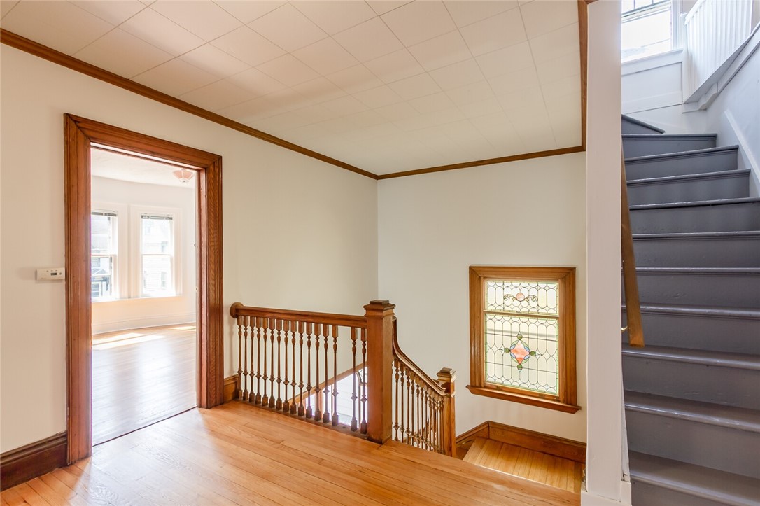 9 Menlo Place Rochester, NY 14620 - Photo 23 of 42 Second floor landing with view of the stained glas