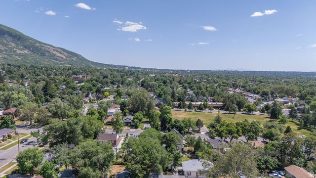 1256 24th Street Ogden, UT 84401 - Photo 27 of 34 Expansive neighborhood featuring mature tree canopy, residential architecture, and a prominent mountain backdrop
