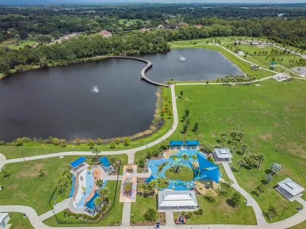 an aerial view of a house a yard and a swimming pool