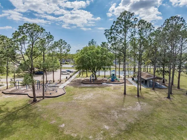 a view of a park with swings and slides