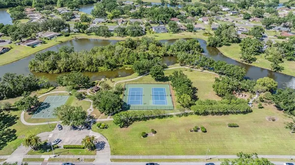 an aerial view of a house with a yard