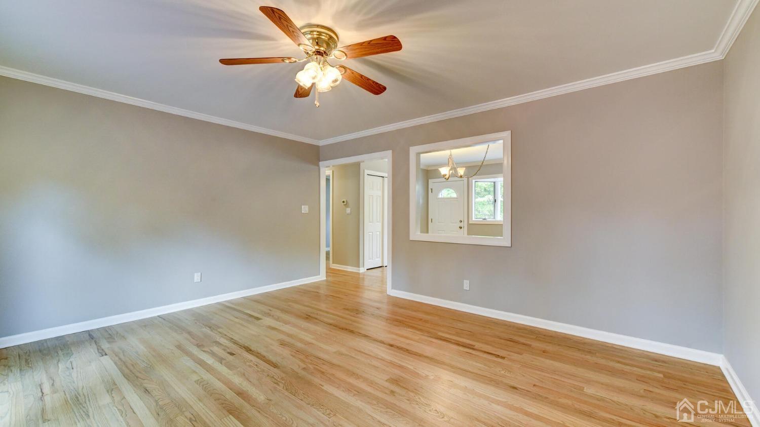 15 Georgetown Road Old Bridge, NJ 08859 - Photo 12 of 34 an empty room with wooden floor and windows