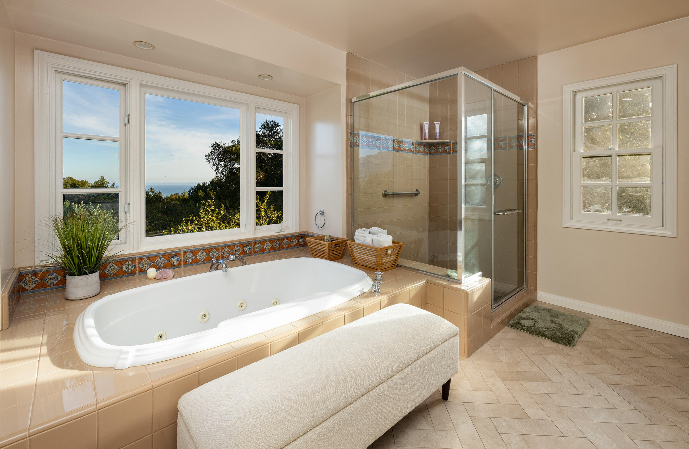 937 Arcady Road Montecito, CA 93108 - Photo 18 of 32 a bathroom with a tub a sink and a large mirror