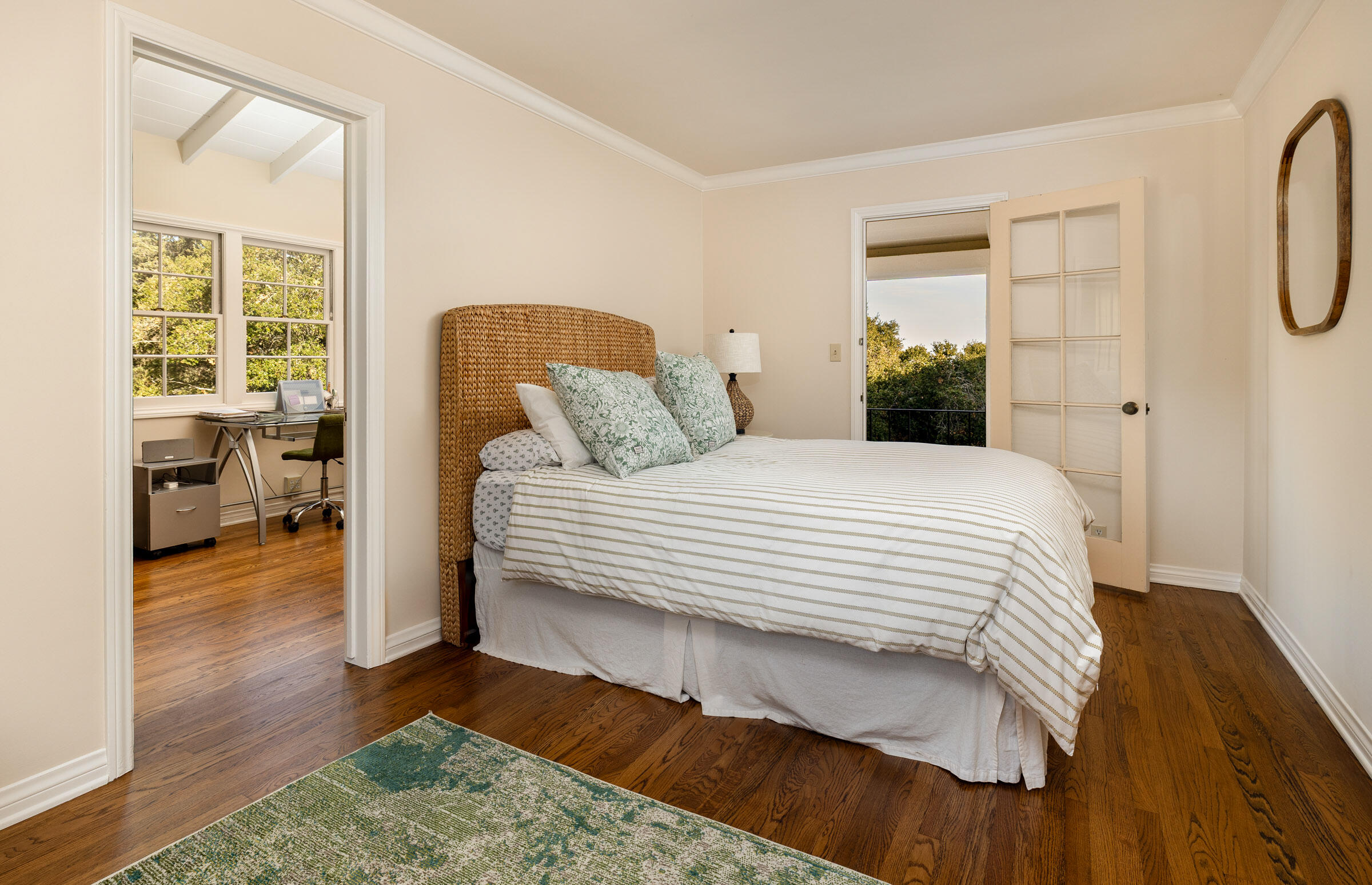937 Arcady Road Montecito, CA 93108 - Photo 23 of 32 a bedroom with a bed and wooden floor