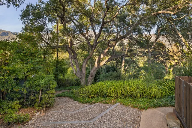 a view of a backyard with sitting area and furniture