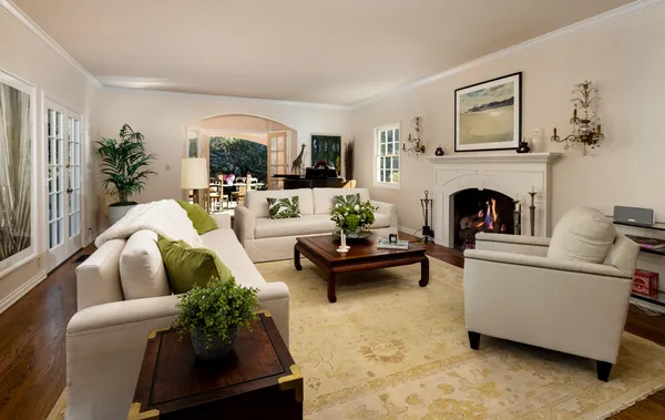 a living room with furniture and a fireplace