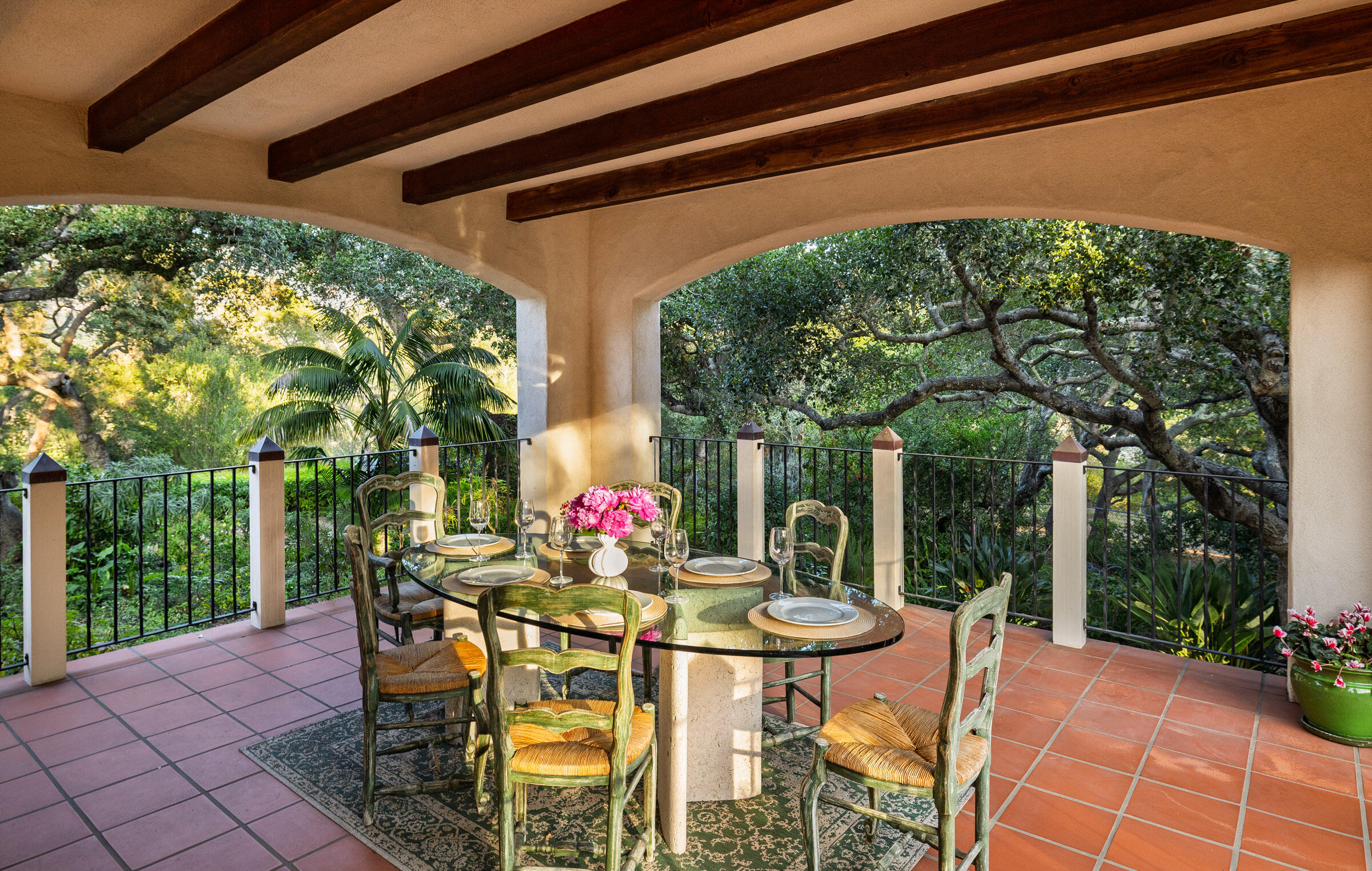 937 Arcady Road Montecito, CA 93108 - Photo 4 of 32 a view of a patio with a table and chairs and potted plants