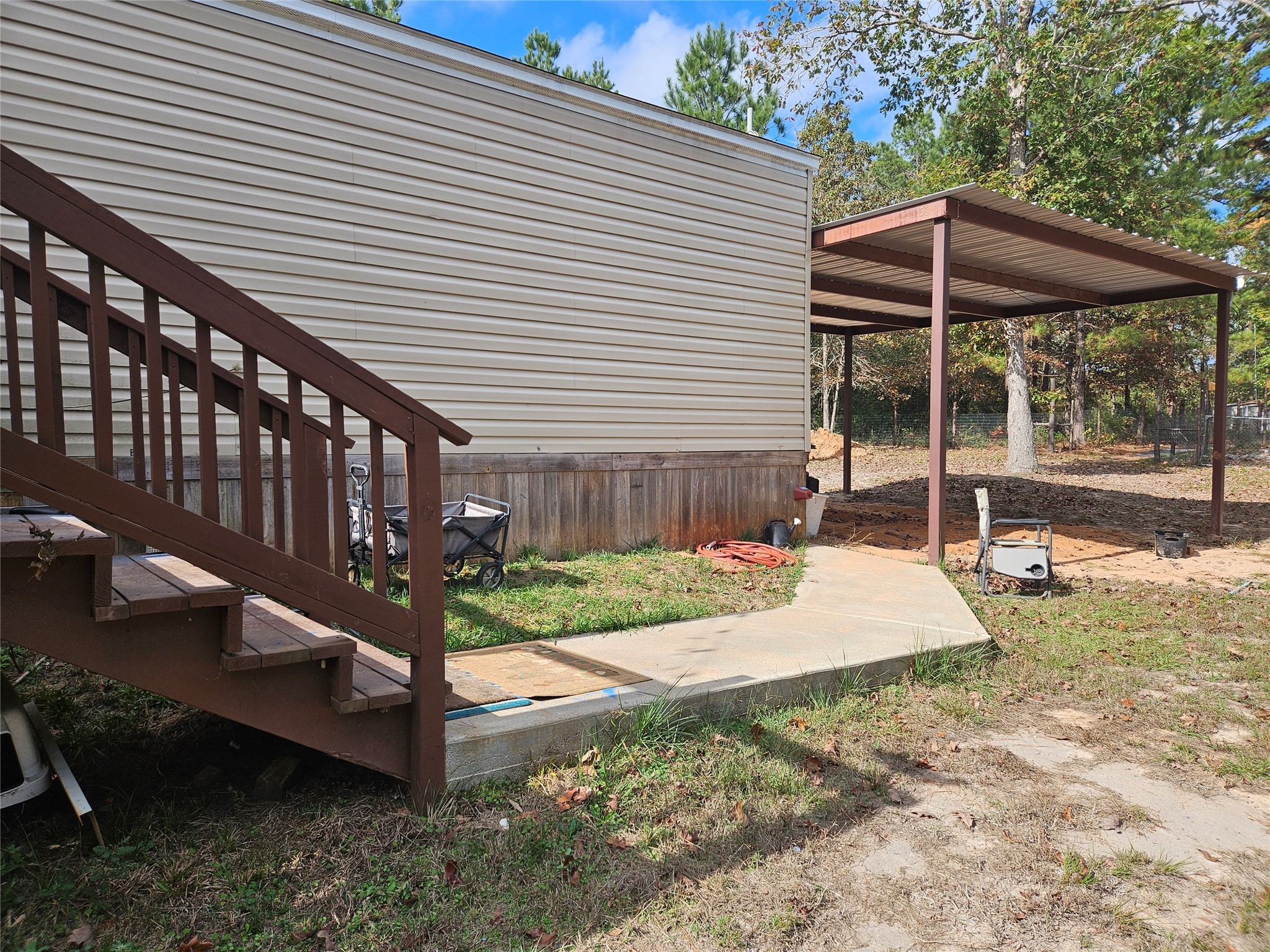 391 Deer Country Road Chester, TX 75936 - Photo 15 of 15 a view of a chair and table in the backyard