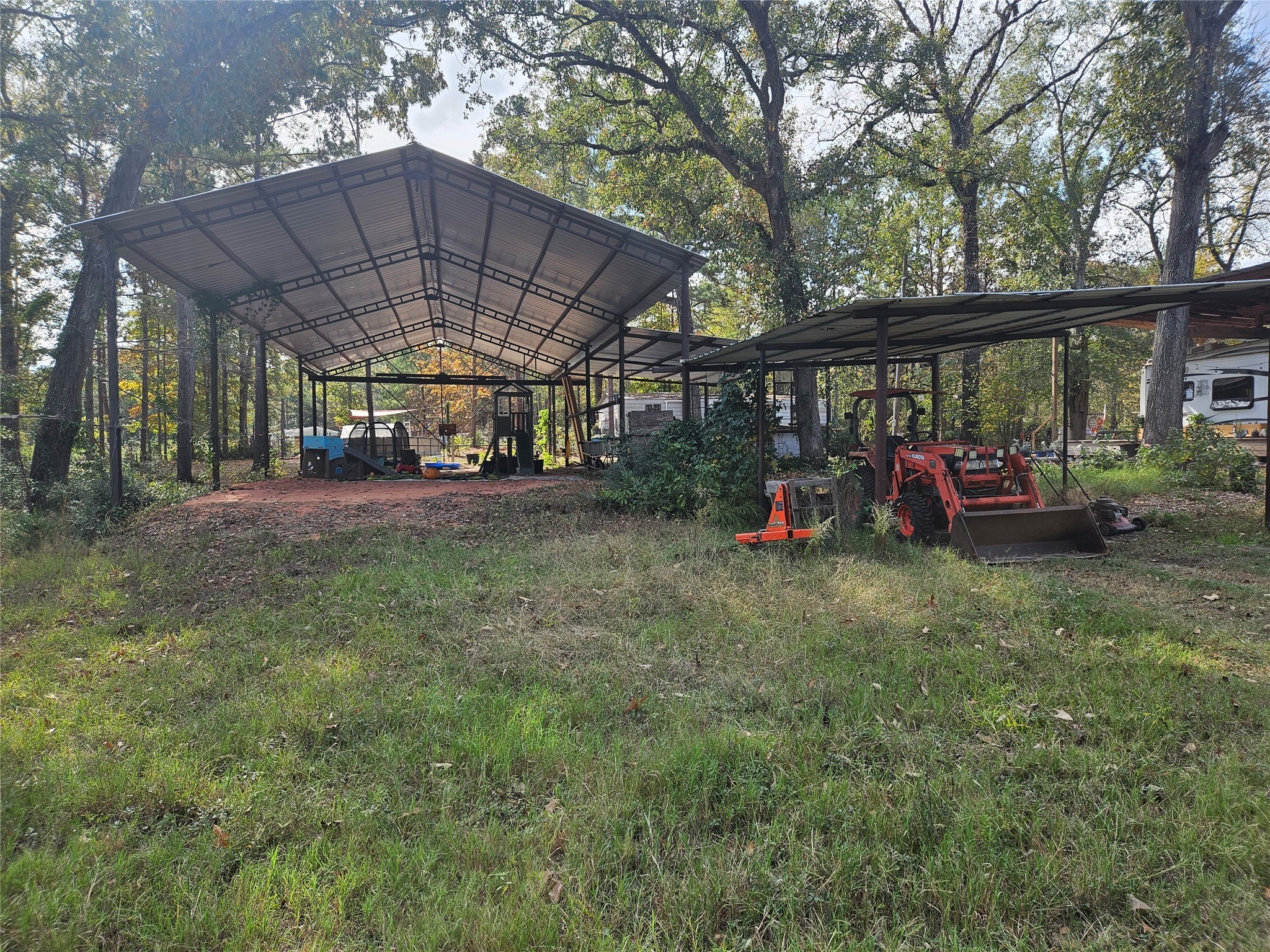 391 Deer Country Road Chester, TX 75936 - Photo 3 of 15 a view of a yard with furniture and a tub