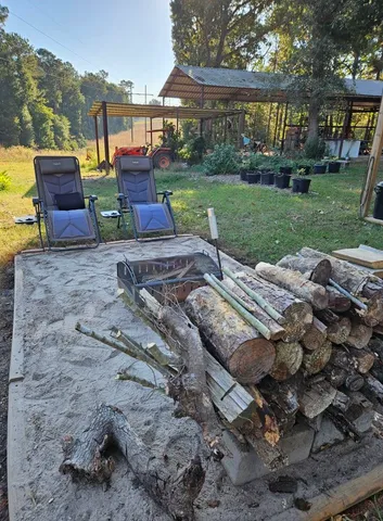 a view of a yard with furniture