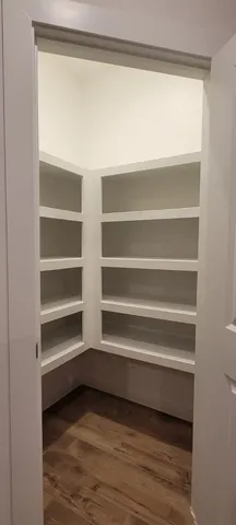 a view of a closet with shelves