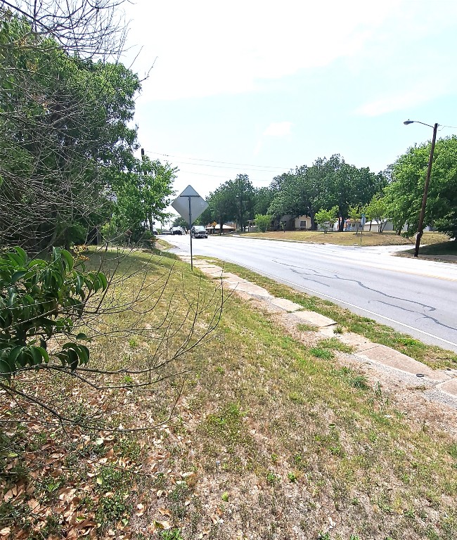 318 Burkett Street Taylor, TX 76574 - Photo 3 of 5 a view of a yard with an outdoor space